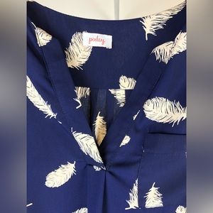 navy blue top with cream feathers, size Small
